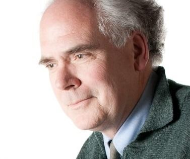 David Howes: “My time in the classroom has helped to stimulate and provide new perspectives on my research endeavours.” Smiling man wearing dark blazer and blue button-up shirt