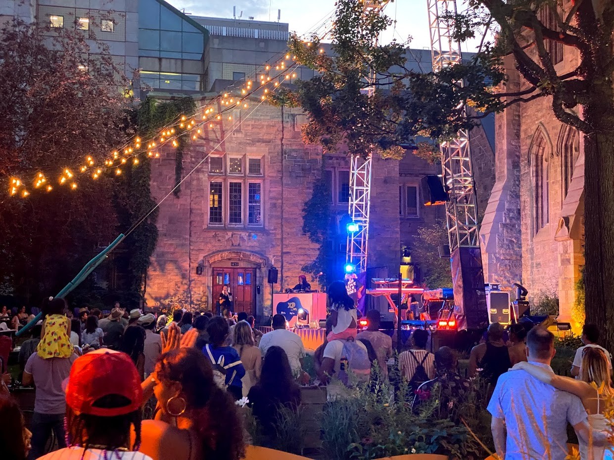 A crowd watching a musical performance A crowd watching a musical performance