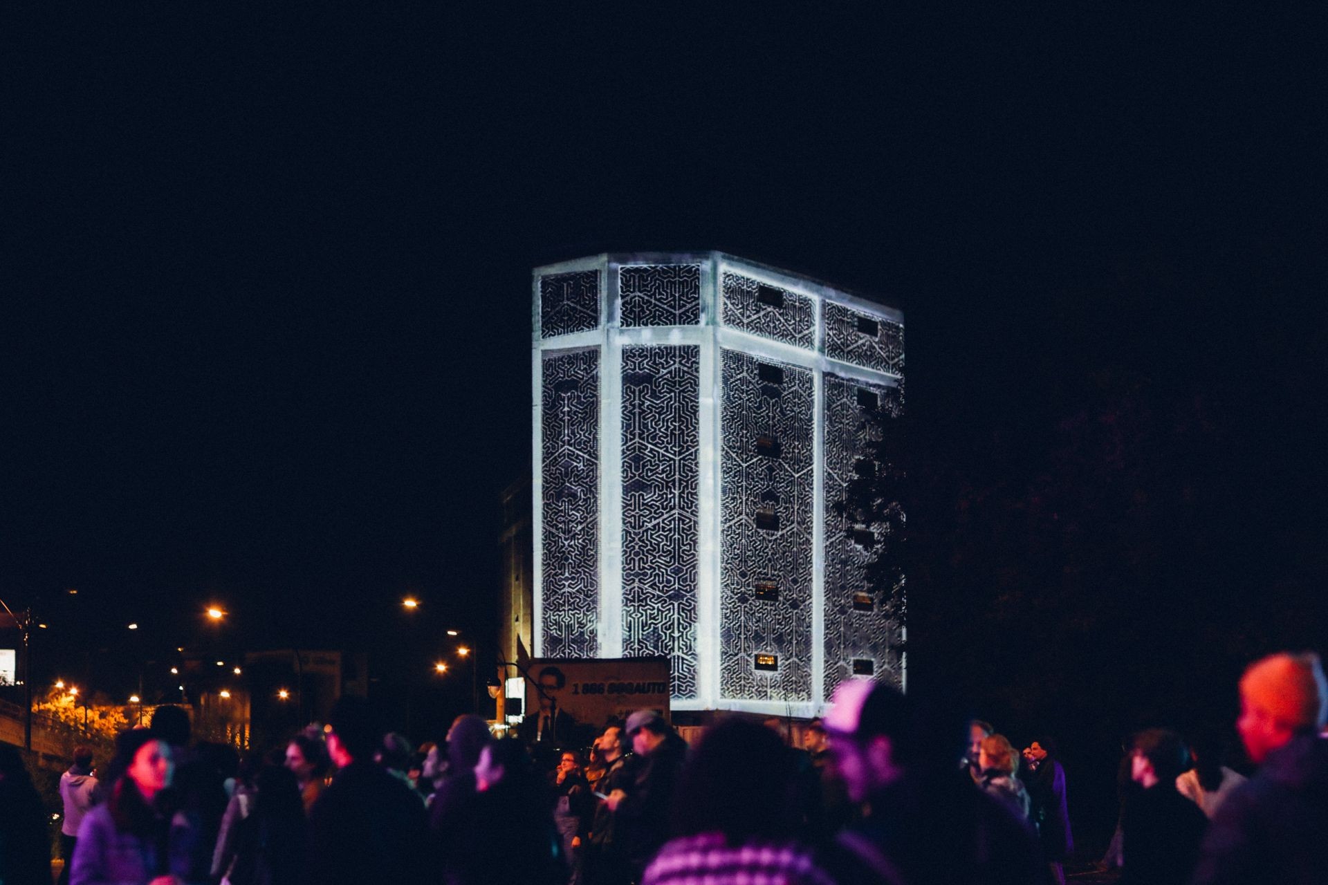 A building in Montreal's Mile End is covered in a digital projection.