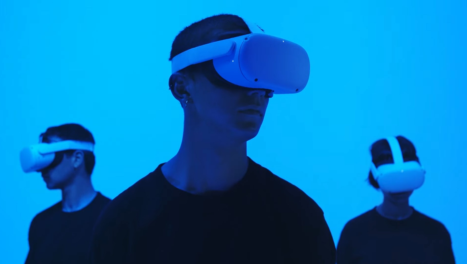 Three men with virtual reality headsets on