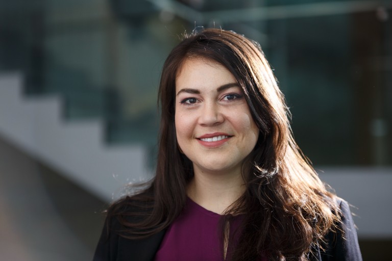 A woman smiles for a portrait on Concordia University's Sir George Williams Campus.