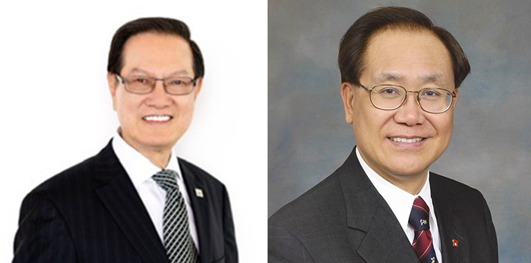 Two smiling, older Asian gentlemen with glasses, wearing suits.