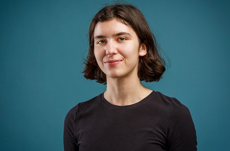 Sarah Lake, digital preservation librarian at Concordia Library. Young, slightly smiling woman with shoulder-length dark hair and a black long-sleeved top.