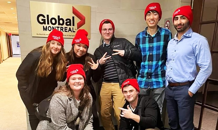 First row: Catherine Houle and Dillon Boucher. Second row: Sarah Abou-Tanos, Jelian Alcos, Noah Martin, Yae-Ha Nam and David Sarno. A group of young people gathered for the camera in an interior corridor with a sign that says, "Global Montreal" on the wall behind them.