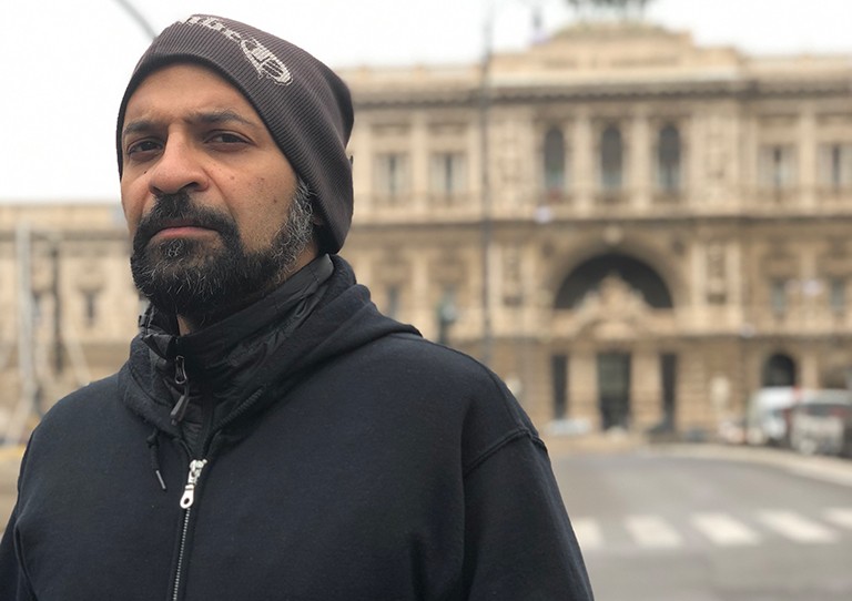 Vivek Venkatesh: “Pluralism is essential in our determination and reification of liberal democratic principles.” | Photo: Maya Detière-Venkatesh Unsmiling man with a dark beard, a brown beanie and a black zipped hoodie.