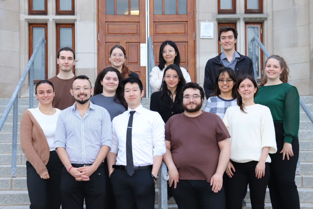 Group of students standing on steps posing for a photo 