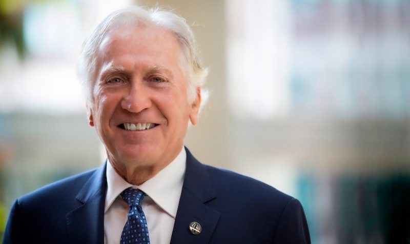Morton Minc: “Social justice and innovation have long been an important part of my judicial work.” Smiling man with short, greying hair, wearing a suit and tie.