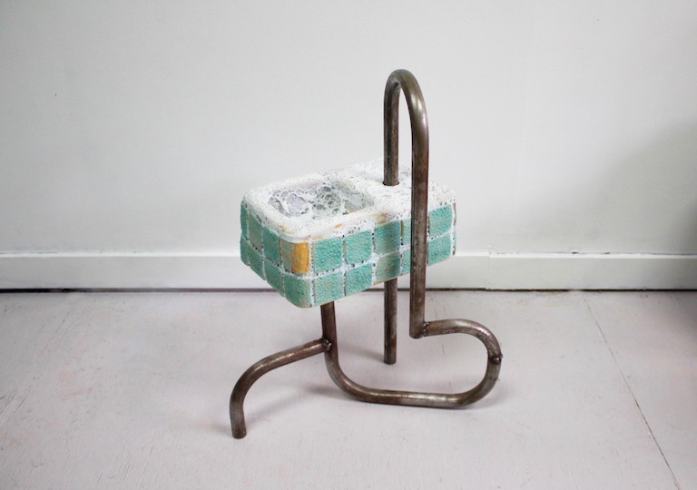 Sink (2022) by Rebecca Ramsey An art sculpture consisting of thin brass pipes twisting into a large sponge-like block
