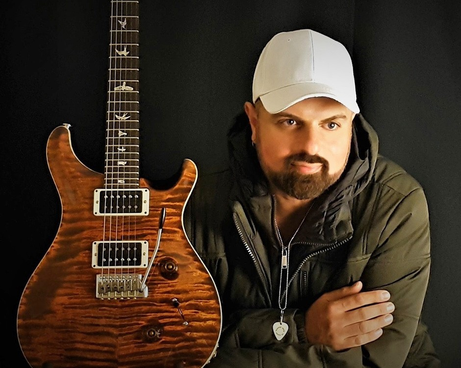 Guitar teacher Artist JAYE pulls strings to help underprivileged children