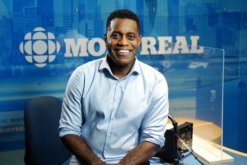 Sean Henry sits at his radio desk