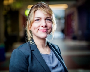 Wearing a blue blazer, Lea Kabiljo smiles for the camera