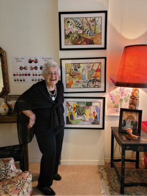 Doris Brown, standing in her living room