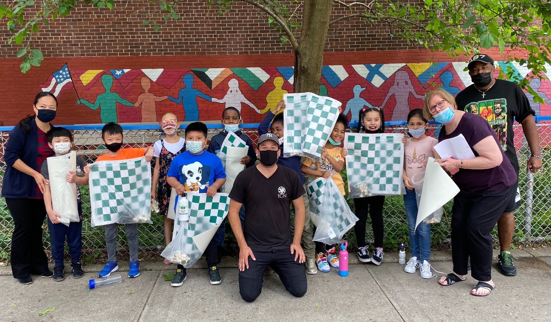 Students wearing masks receive 10,000 chess sets in New York City