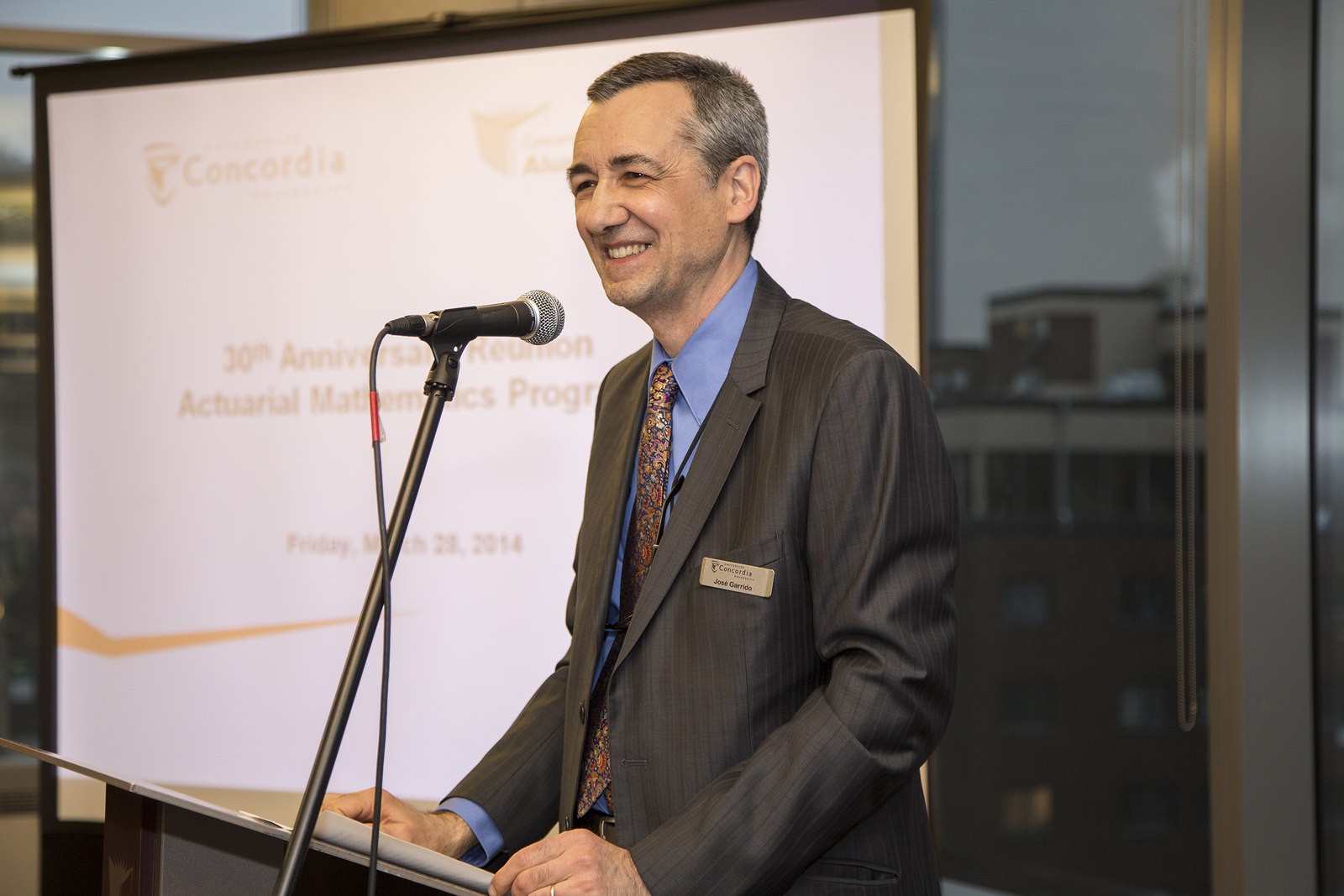 José Garrido speaking into a microphone