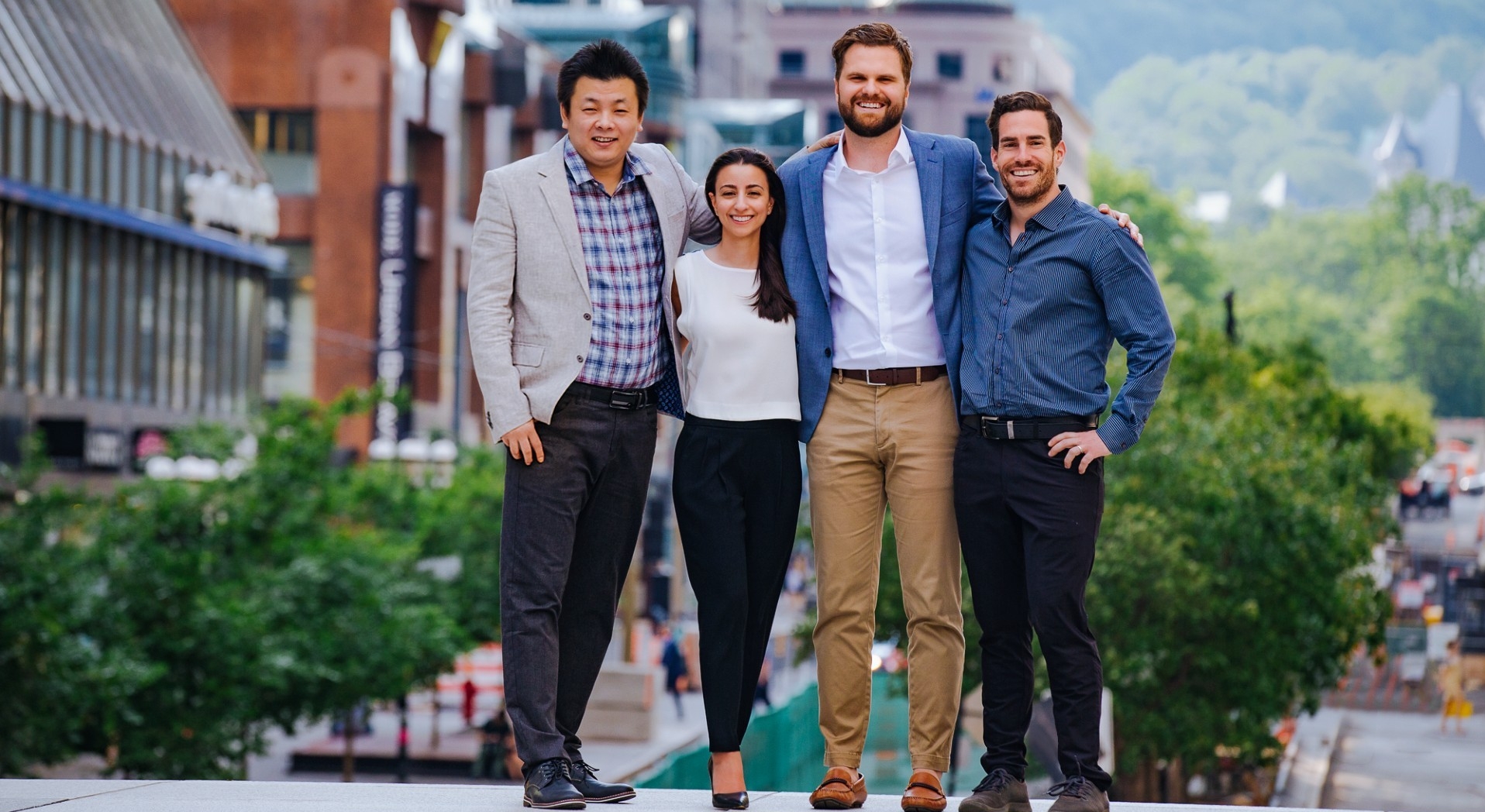 Four founders of GoMaterials standing on a street