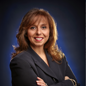 Mireille Garabedian, wearing a dark suit, arms folded across her chest