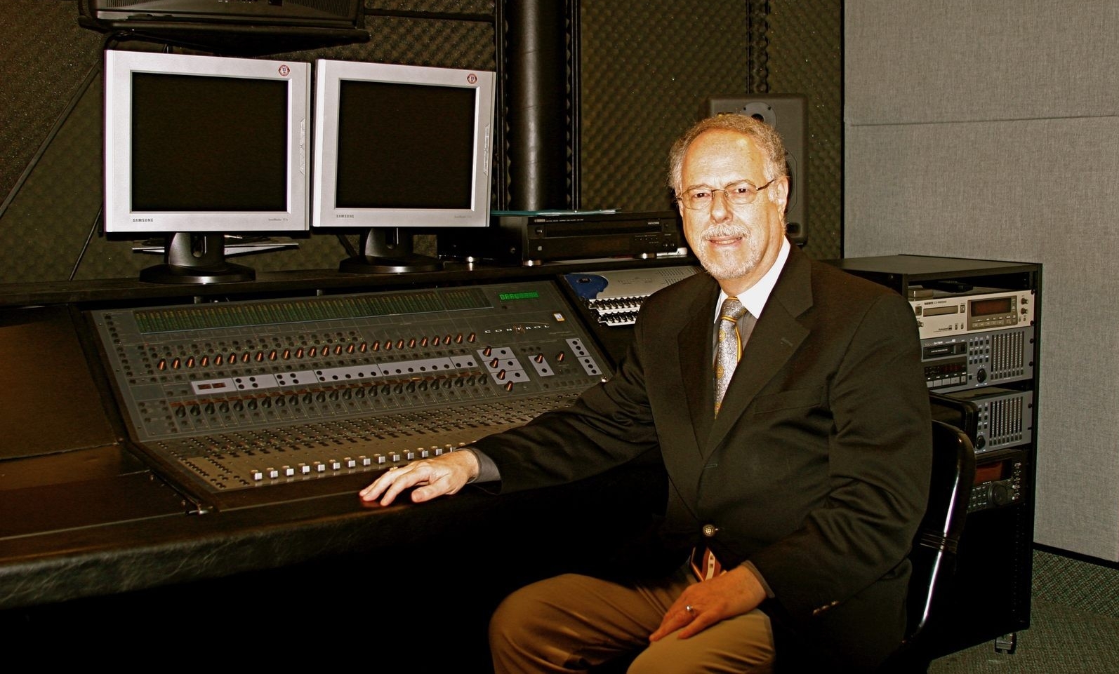 David Leonard sits at a sound engineering board