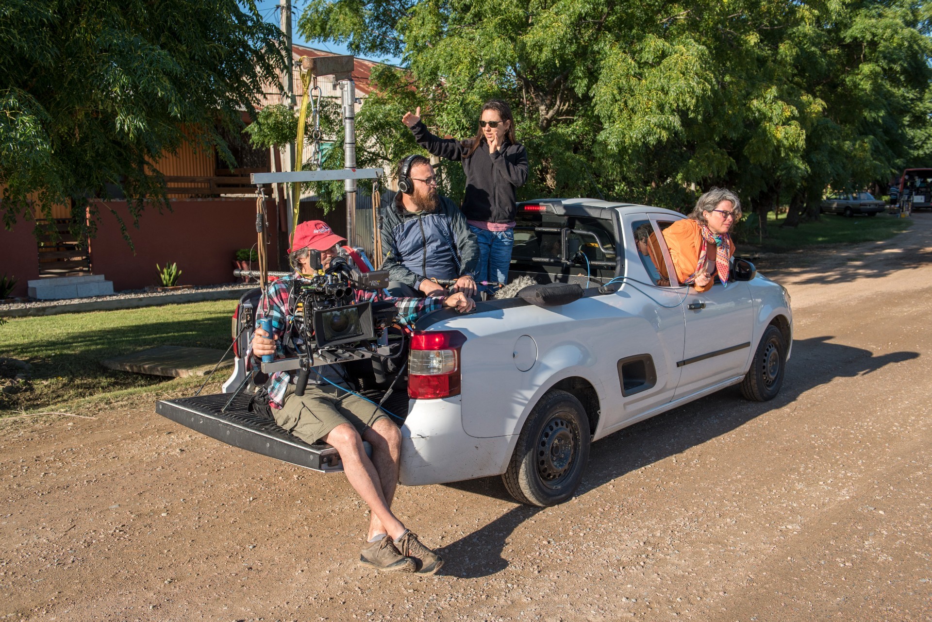 Katherine Jerkovic with her film crew in a car rig.