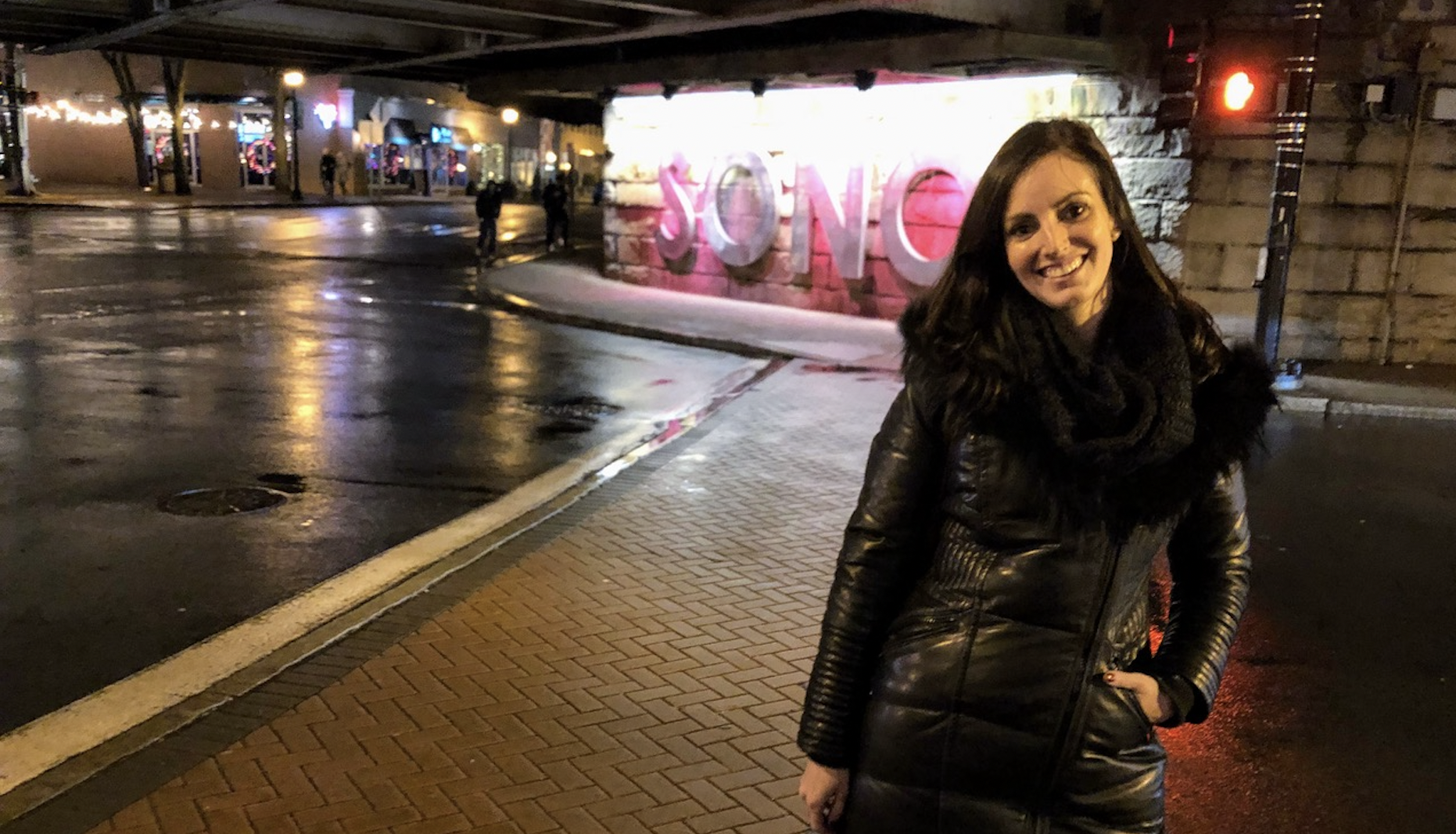 Sarah Pack wears a fashionable winter parka with a faux fur collar