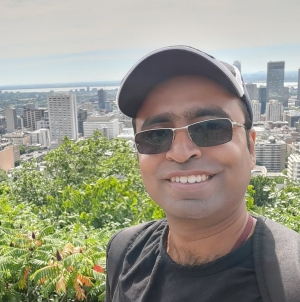 Azfar Adib wears a ball cap and sunglasses