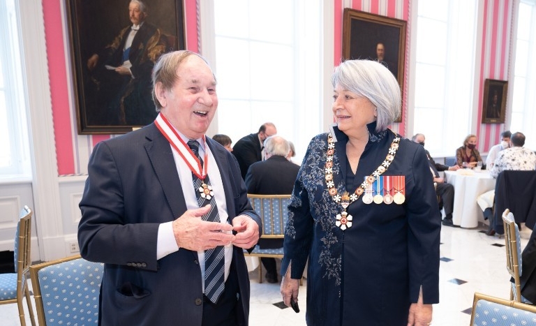 James O’Reilly stands next to Mary Simon, Governor General of Canada, at the ceremony for the Order of Canada