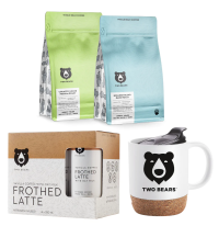 Packages of coffee beans, oat milk and a mug with a bear on it