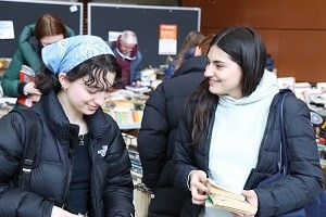 Two customers look at books