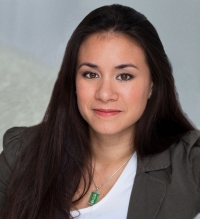 Portrait of a woman wearing white T-shirt and khaki blazer