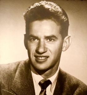 A black-and-white yearbook photo of Mike Gutwillig