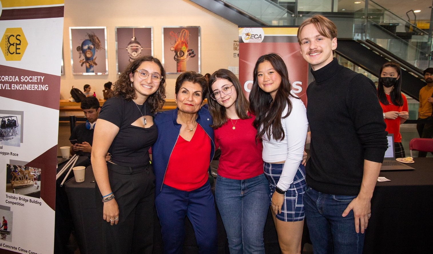 Group of Concordia students pose for a photo with donor Gina Cody