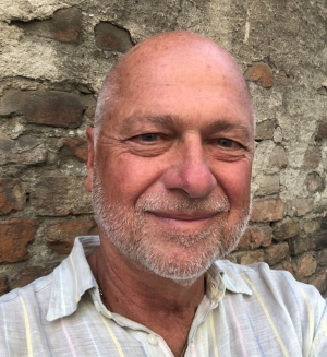 portrait of a man with beard wearing a white shirt