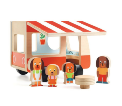 An image of wooden children's toys, which include a family of dogs and a trailer
