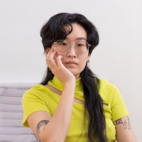 Portrait of a person wearing a yellow top