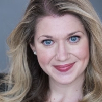 A woman with long blonde hair sits smiling for a portrait.
