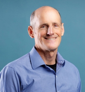Headshot of Tim Evans.
