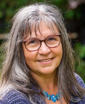 Headshot of Suzanne Caron.
