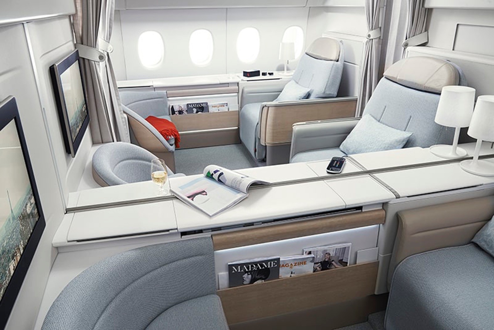 A computer generated rendering of a futuristic first class airplane interior