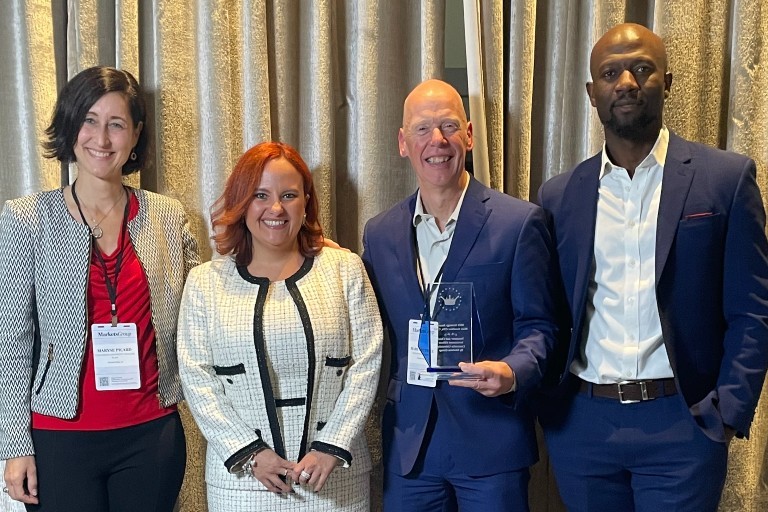 Marc Gauthier holding the Strategy Award, standing with colleagues Maryse Picard, Ingrid Ulloa and Abdel Chabi-Yo at the Canada West Institutional Forum.