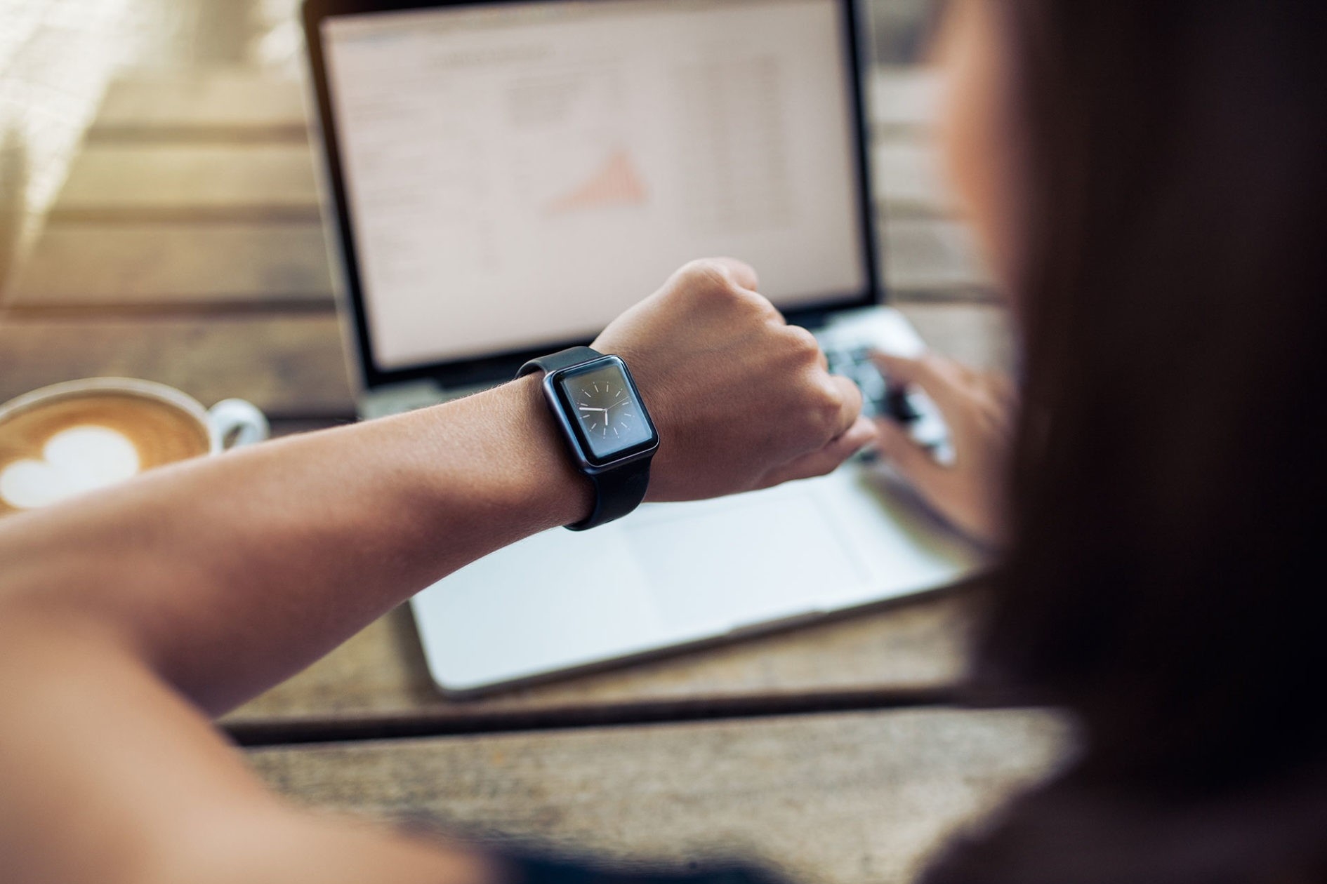 Time management person looking at a watch