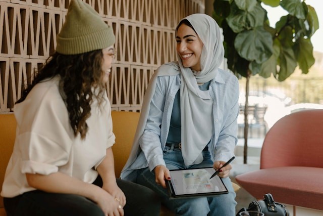 Two colleagues talking and smiling