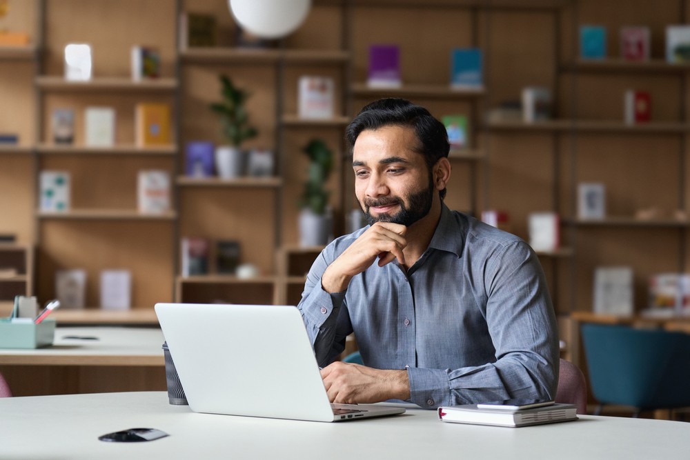 man works at laptop