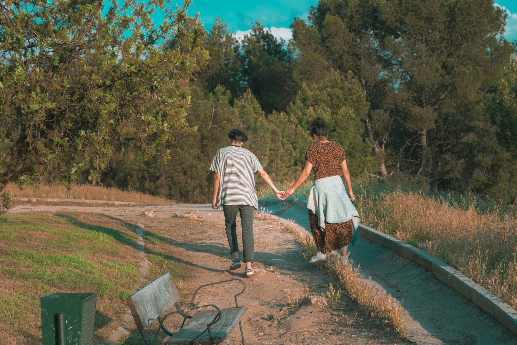 People walking holding hands