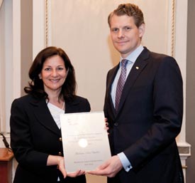 Silvia Ugolini is distinguished before peers by Yves L. Giroux, president of the Institut québécois de planification financière board of directors