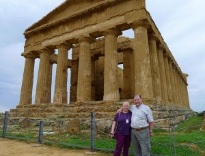 Suzanne and Jim Leworthy, S BComm 66, in front of the Concordia Temple. Located in the Valley of Temples in Agrigento, Sicily, the Concordia Temple was built around 5-6 BC.