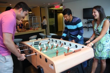 Relaxing at the foosball table in the cafeteria at Vigilant Global