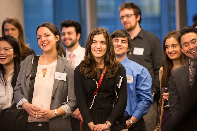 Alumni enjoy a laugh during the speeches at the 30th anniversary reunion cocktail for the Actual Mathematics program.