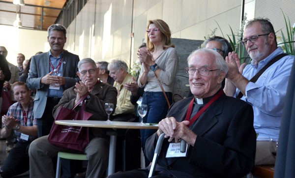 Father O’Brien (seated, at right), at the Department of Communication Studies 50th anniversary celebration 