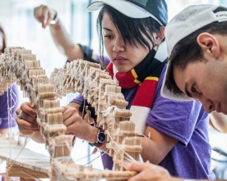 Student building a bridge