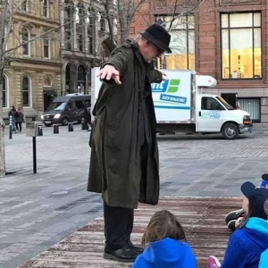 Donovan King leading a tour in Old Montreal.