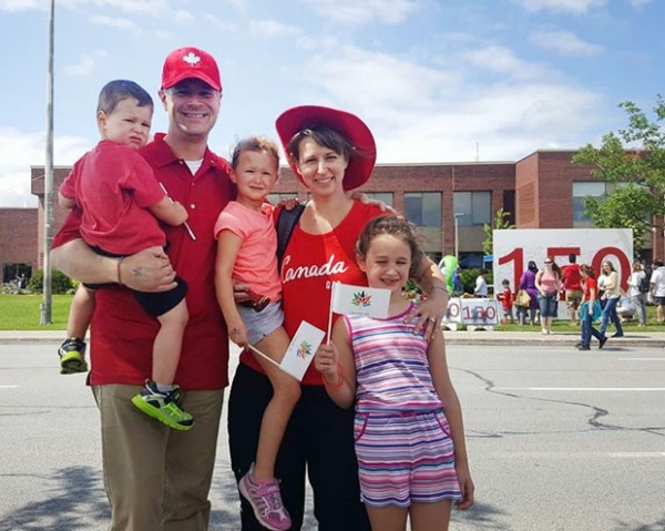 Alex Bottausci with his wife and three children